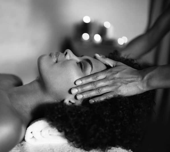 Shot of a beautiful young woman getting a head massage at a spa